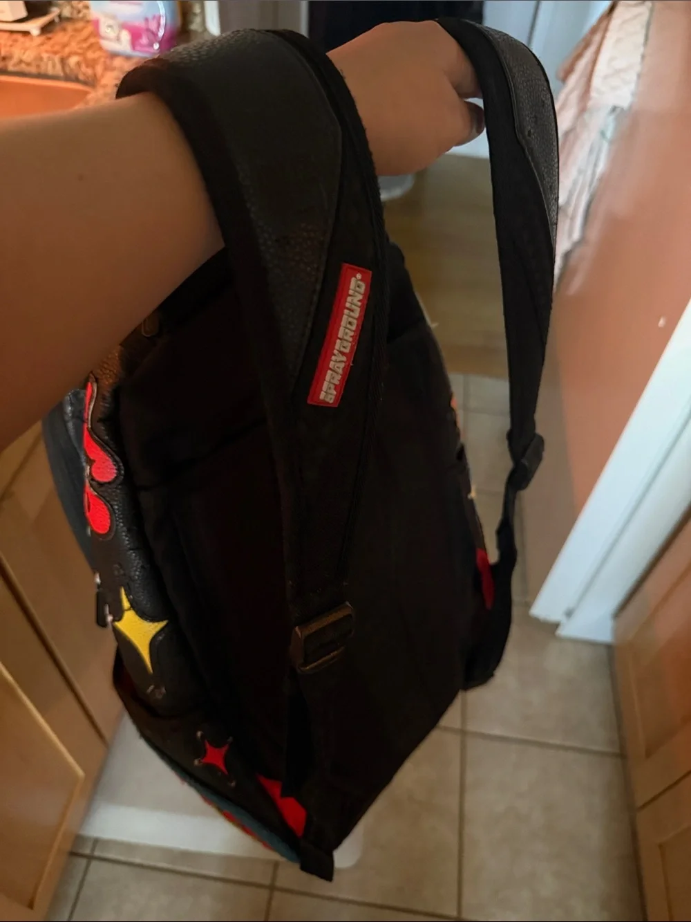 Sprayground Black Backpack with Neon Green Bear Patch and Multicolor Accents
